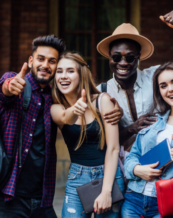 four-happy-students-near-university-campus